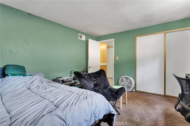 bedroom with carpet floors and a closet