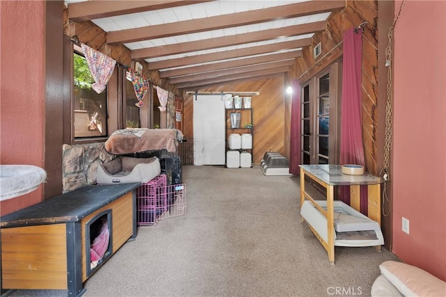 miscellaneous room with vaulted ceiling with beams, carpet floors, and wooden walls