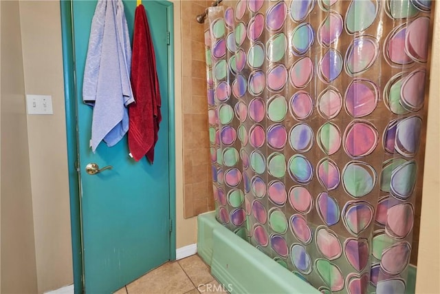 bathroom with tile patterned flooring and shower / bath combination with curtain