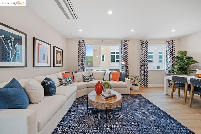 living room with light hardwood / wood-style flooring