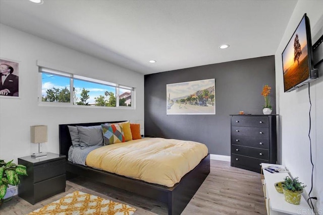 bedroom with light hardwood / wood-style flooring