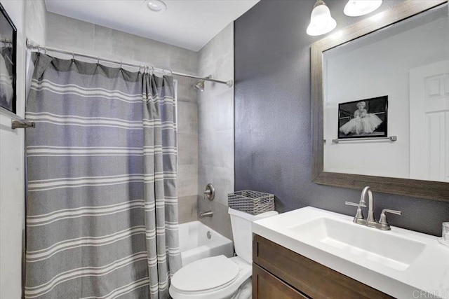 full bathroom with shower / bath combo with shower curtain, toilet, and vanity