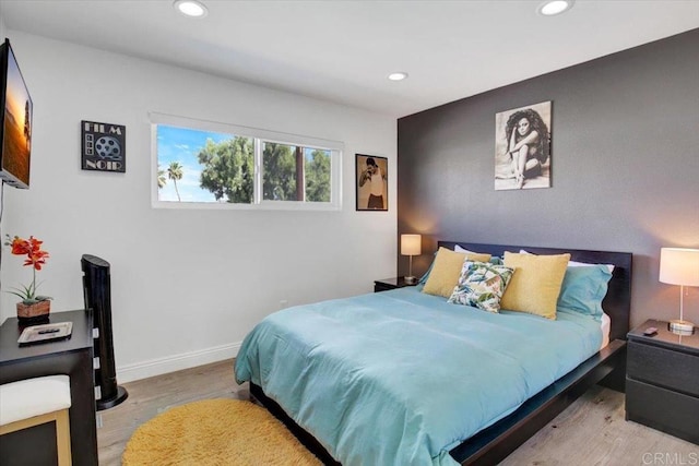 bedroom with light hardwood / wood-style floors