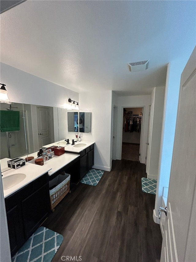 bathroom featuring wood-type flooring and vanity