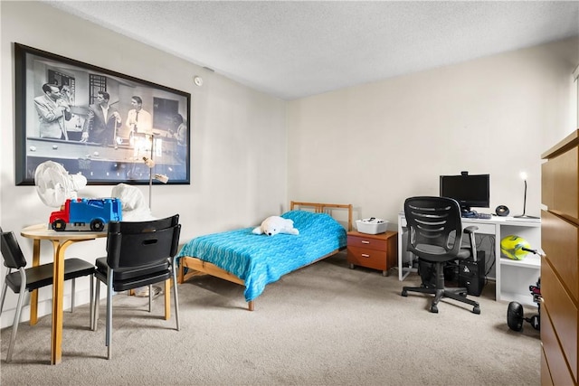 carpeted bedroom featuring a textured ceiling