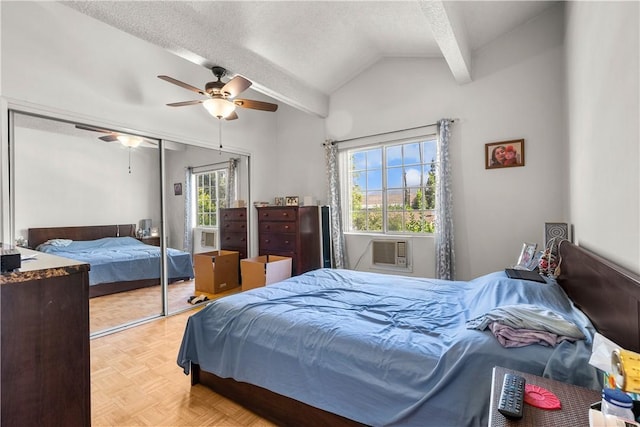 bedroom featuring multiple windows, vaulted ceiling with beams, a closet, ceiling fan, and light parquet floors