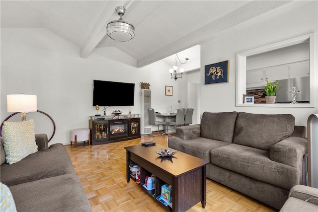 living room featuring a fireplace, light parquet flooring, an inviting chandelier, and vaulted ceiling with beams