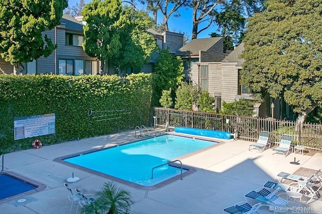 view of pool featuring a patio area