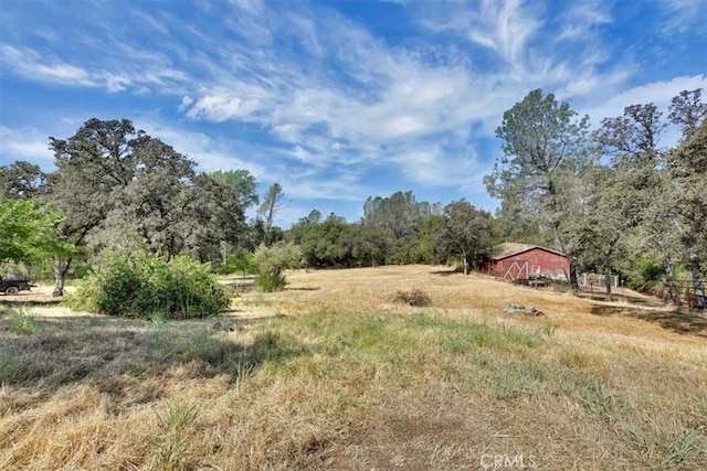 view of yard with a rural view