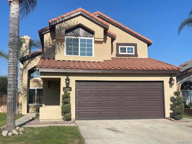 mediterranean / spanish-style house featuring a garage