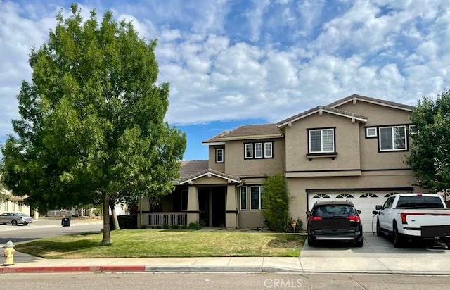 front of property with a garage and a front lawn