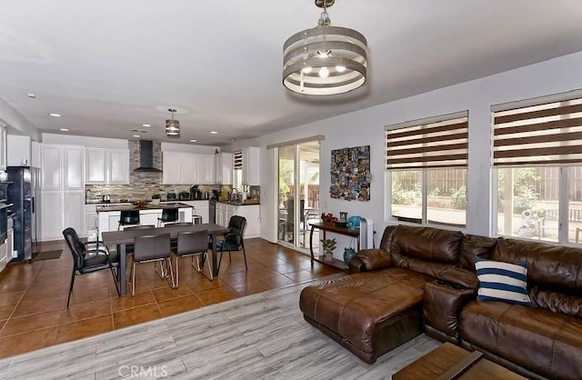 tiled living room featuring sink