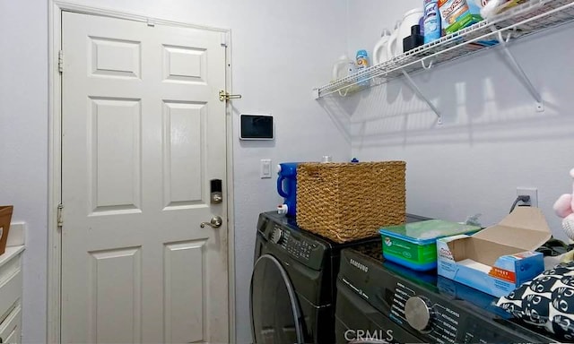 laundry room featuring washing machine and dryer