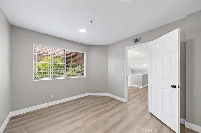 unfurnished room featuring light wood-type flooring