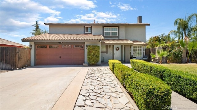 mediterranean / spanish-style home featuring a garage