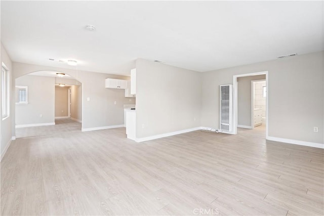 unfurnished living room featuring light wood-type flooring