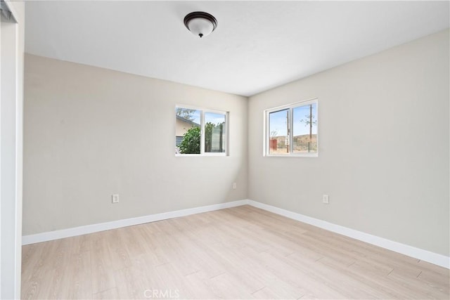 unfurnished room featuring light hardwood / wood-style flooring