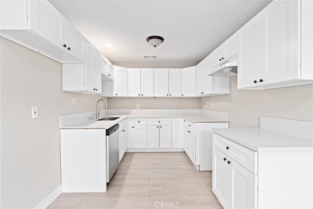 kitchen with white cabinetry, dishwasher, sink, and light hardwood / wood-style flooring