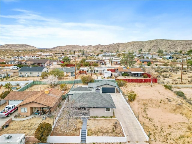 birds eye view of property featuring a mountain view