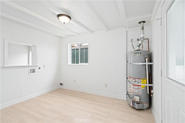 utility room featuring water heater