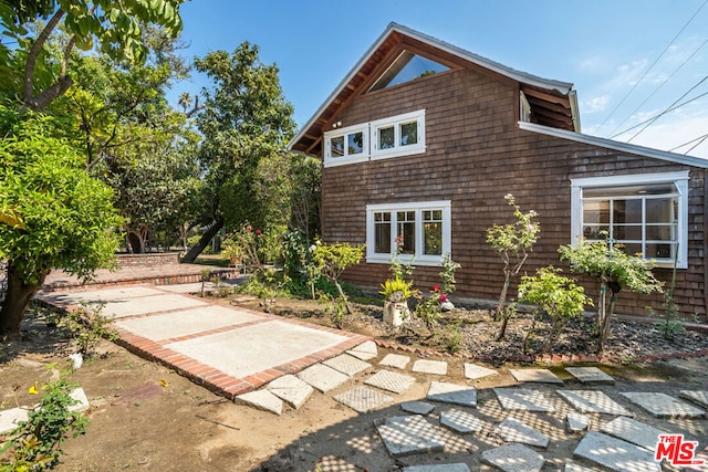 view of property exterior featuring a patio area