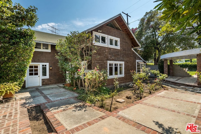 back of house with a patio area