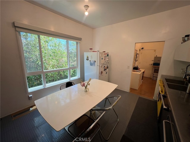 dining room featuring hardwood / wood-style flooring and sink