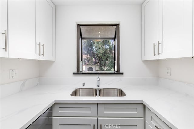 kitchen with white cabinets and sink