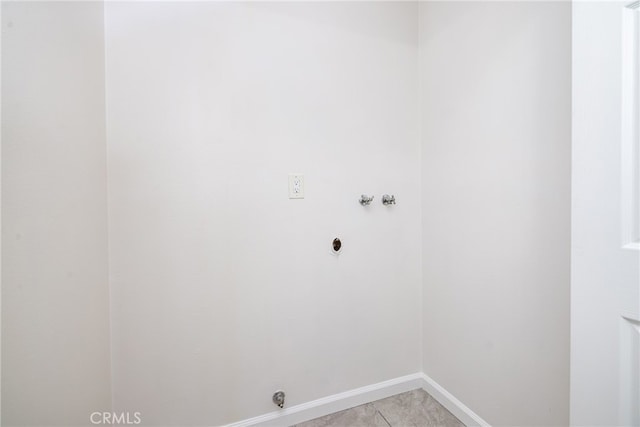 laundry room with washer hookup, electric dryer hookup, and light tile patterned floors