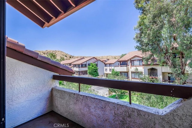 balcony featuring a mountain view