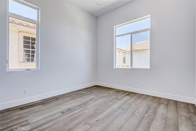 unfurnished room featuring light wood-type flooring