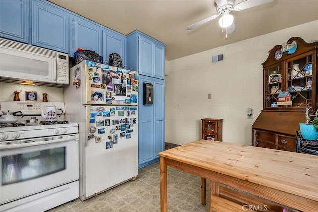 kitchen featuring white appliances, blue cabinets, and ceiling fan