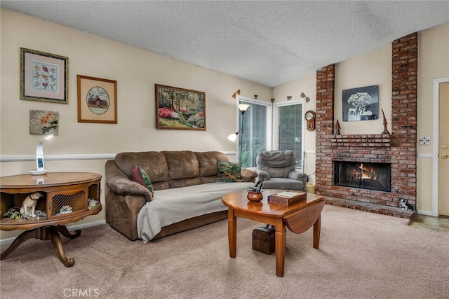 living room with light colored carpet, a textured ceiling, and a fireplace