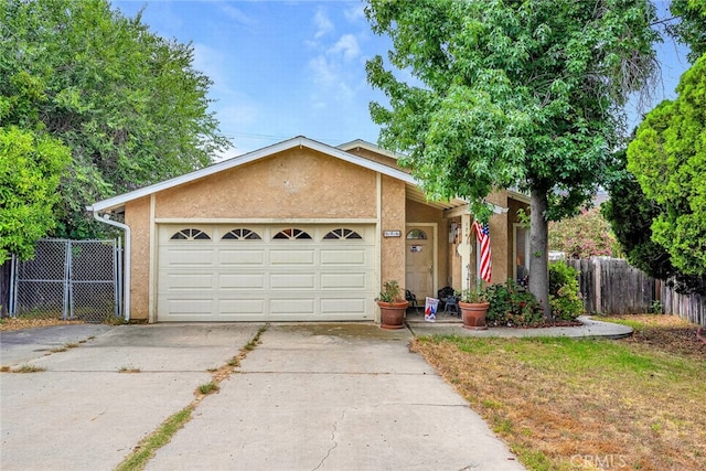 ranch-style house featuring a garage