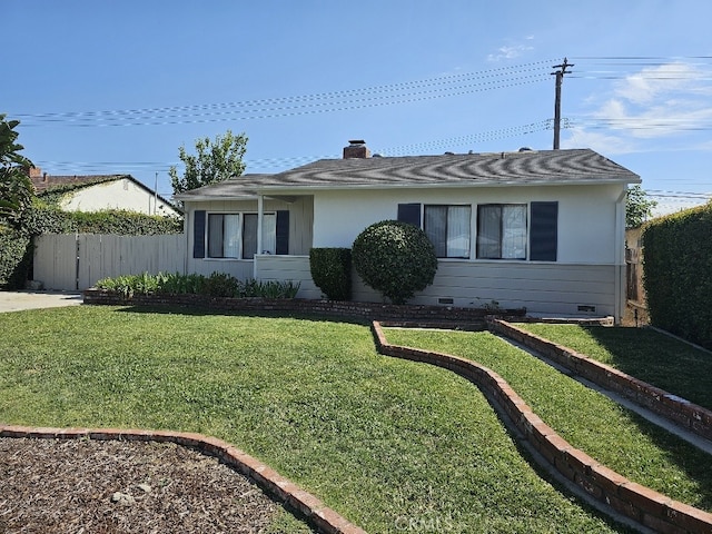 single story home with a front lawn