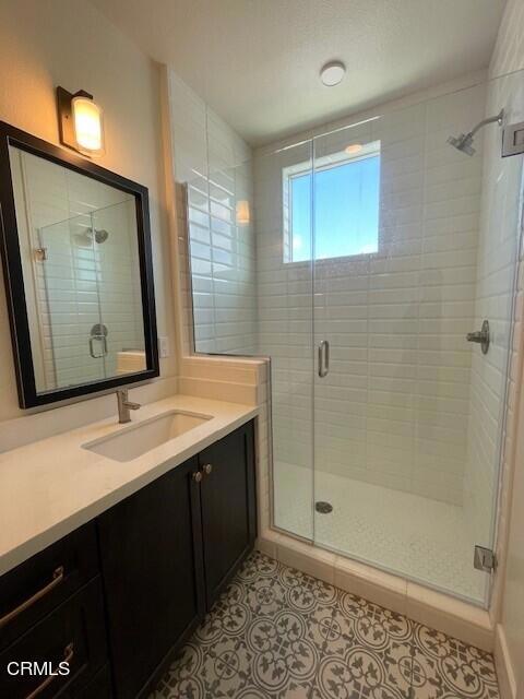 bathroom featuring vanity and walk in shower