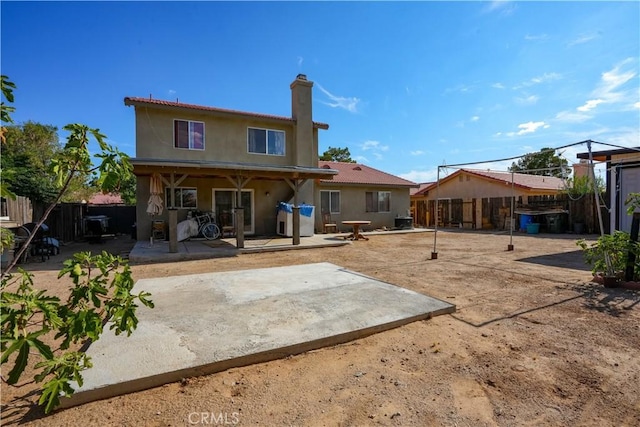 rear view of property with a patio area