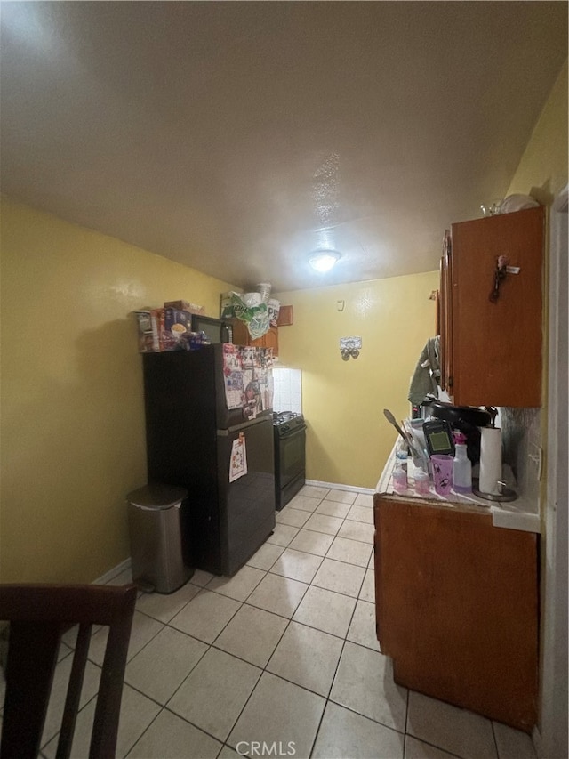 kitchen with light tile patterned flooring