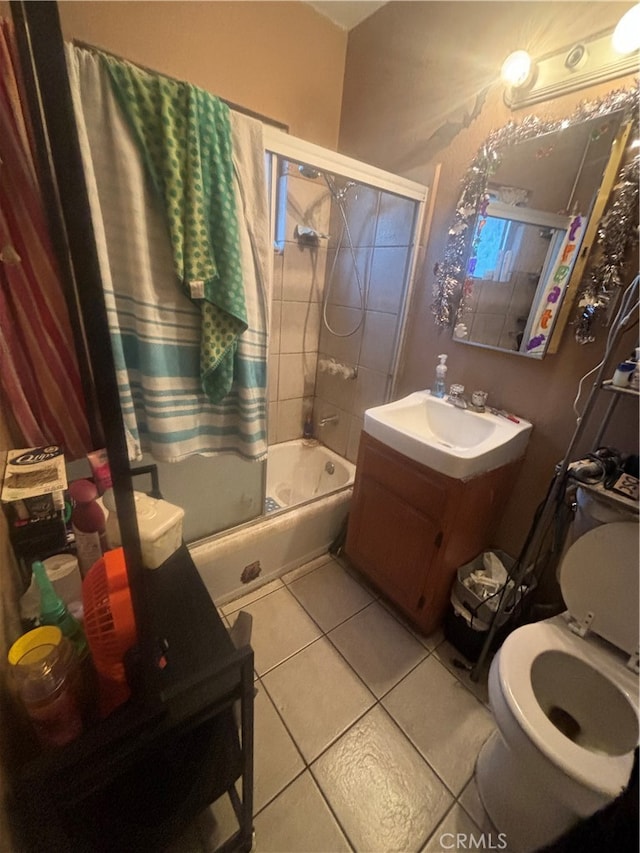 full bathroom featuring vanity, shower / tub combo, toilet, and tile patterned floors