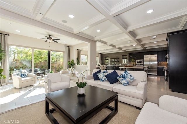 tiled living room with ceiling fan, beamed ceiling, ornamental molding, and coffered ceiling