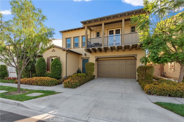 view of front of house with a balcony and a garage