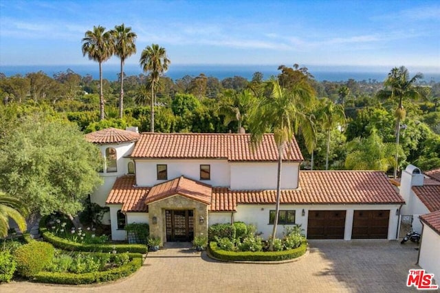 mediterranean / spanish-style house featuring a garage