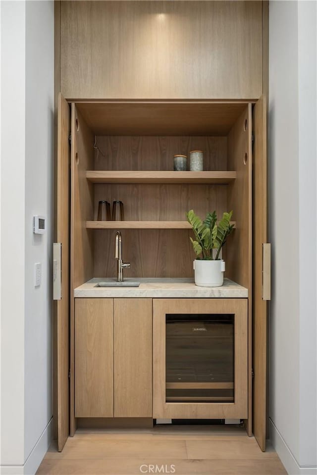 13 Ritz Cove Dr, Dana Point, CA 92629 - indoor wet bar with wine cooler, baseboards, and light wood-type flooring