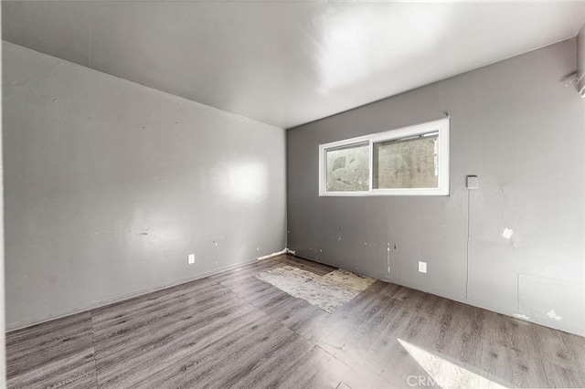 spare room with light hardwood / wood-style floors