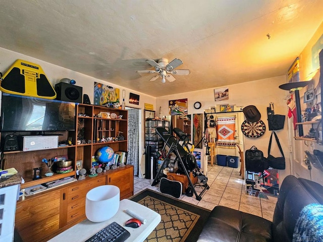 interior space with ceiling fan