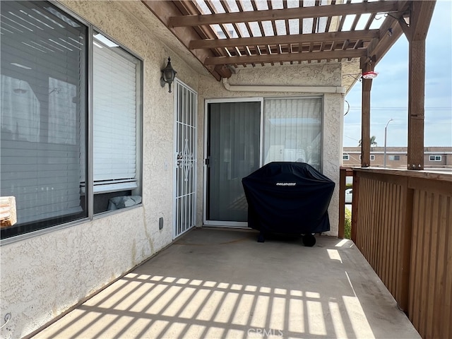 view of patio / terrace with a grill and a pergola