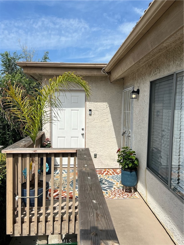 property entrance featuring a patio