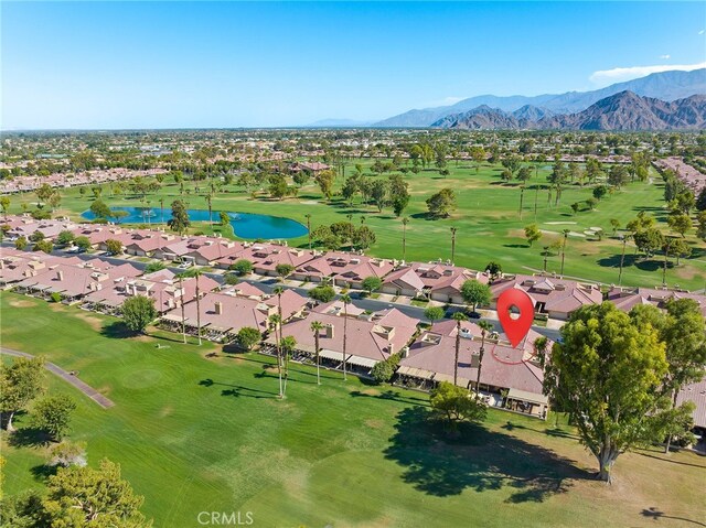 birds eye view of property featuring a water and mountain view