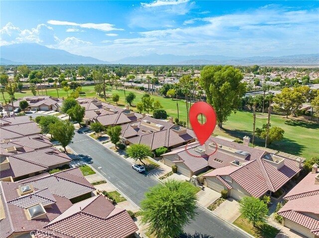 birds eye view of property with a mountain view