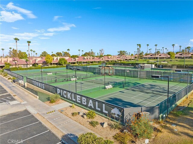 77640 Woodhaven Dr N, Palm Desert, CA 92211 - view of tennis court with a residential view
